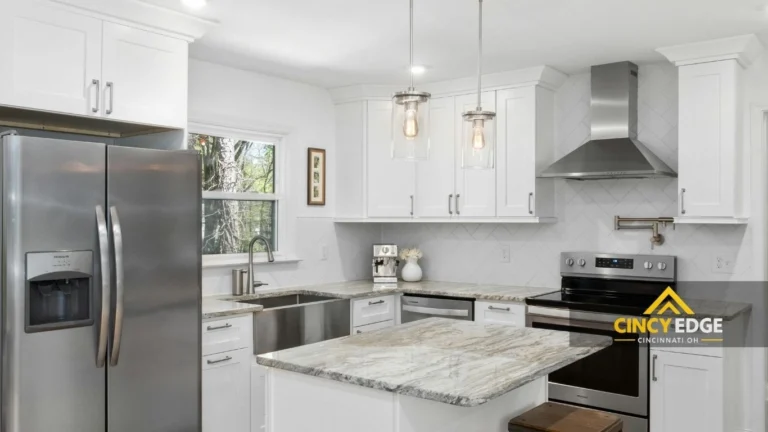 Kitchen remodel Cincinnati - white cabinets with marble countertop and stainless steel appliances
