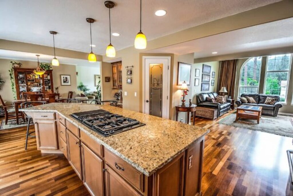 Kitchen Remodel Cost in Cincinnati 1 Modern kitchen remodel with granite countertops and open living space in Cincinnati, Ohio.